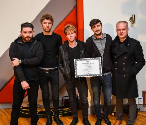 Kodaline's Jason Boland reveives his certificate from Keith Johnson of IMRO making him the 10,000th member of the Irish Music Rights Organisation.